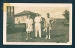 Hugh, George Shelby and Don Honeysett outside their residence, Rabaul, New Guinea, c1929 to 1931