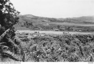 WAU, NEW GUINEA, 1943-01. DOUGLAS C47 DAKOTA TRANSPORT AIRCRAFT ON STRIP. (DONATED BY LADY MACKAY)