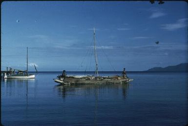 Lisu and trading canoe, looking towards Goodenough Island : Mapamoiwa Station, D'Entrecasteaux Islands, Papua New Guinea, 1956-1959 / Terence and Margaret Spencer