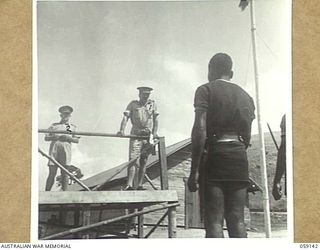 KILA, NEW GUINEA, 1943-10-24. MAJOR-GENERAL B.M. MORRIS, DSO., GENERAL OFFICER COMMANDING, AUSTRALIAN AND NEW GUINEA ADMINISTRATIVE UNIT, ADDRESSING, NATIVES AT THE NATIVE LABOUR CAMP, WHILE PX134 ..