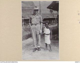 TOROKINA, BOUGAINVILLE, 1945-07-16. LT-COL D. ZACHARIN, COMMANDING OFFICER, 106 CASUALTY CLEARING STATION, WITH ONE OF HIS NATIVE PATIENTS WHO WAS BADLY BURNT IN A FIRE