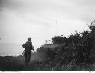 SATTELBERG AREA, NEW GUINEA. 1943-11-17. TANKS OF THE 1ST AUSTRALIAN ARMY TANK BATTALION MOVING FORWARD FOR THE ATTACK ON SATTELBERG CLOSELY FOLLOWED BY TROOPS OF THE 2/48TH AUSTRALIAN INFANTRY ..