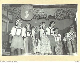 LAE, NEW GUINEA. 1944-08-11. THE WALTZ SCENE IN PROGRESS DURING THE SHOW STAGED FOR THE PATIENTS OF THE 113TH CONVALESCENT DEPOT BY THE WHITE HORSE INN CONCERT PARTY. THE CONCERT PARTY CONSISTS OF ..