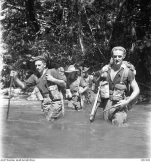 GAZELLE PENINSULA, NEW BRITAIN, 1945-05-14. TROOPS OF A COMPANY, 37/52 INFANTRY BATTALION, CROSSING A RIVER DURING THE FOURTH DAY OF THEIR TREK FROM RILE TO MAVELU, OPEN BAY. IDENTIFIED PERSONS ..