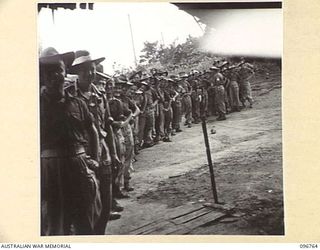 KARAWOP, NEW GUINEA, 1945-09-18. MEMBERS OF 2/6 CAVALRY COMMANDO REGIMENT EDUCATION SECTION, LINED UP FOR THEIR PAY