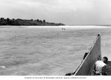 Researchers aboard the M-boat approximately 100 yards from Rigili Island's beach, summer 1964