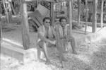 Two employees of Agricultural Department resting at Luciano's cookhouse