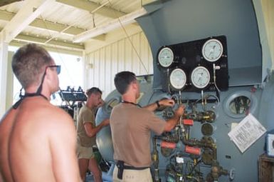 Members of Underwater Construction Team Two (UCT-2) train on running a recompression chamber at the Pacific Missile Range Facility at Kauai, Hawaii.(Exact date unknown)