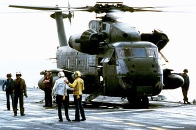 A CH-53 Sea Stallion helicopter on the flight deck of the amphibious assault ship USS GUAM (LPH 9) during Operation URGENT FURY off the coast of Grenada