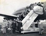 Passengers waving and boarding TWA flight