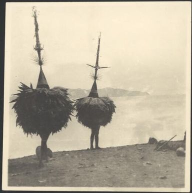 Two Dukduks on a beach at Rabaul Harbour, New Guinea, 1929, 1 / Sarah Chinnery