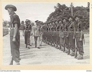 TOROKINA, BOUGAINVILLE, 1945-06-13. THE GOVERNOR GENERAL OF NEW ZEALAND, MARSHAL OF THE ROYAL AIR FORCE, SIR CYRIL L.N. NEWALL (4); INSPECTING THE AUSTRALIAN GUARD OF HONOUR, 7 INFANTRY BRIGADE, AT ..