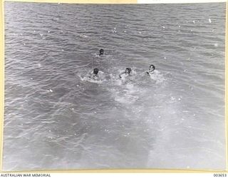 PORT MORESBY - HUMAN FISH AFTER COINS. RAAF SURVEY FLIGHT. (NEGATIVE BY N. TRACY)