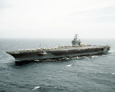 A port bow view of the nuclear-powered aircraft carrier USS Abraham Lincoln (CVN-72) underway near Hawaii
