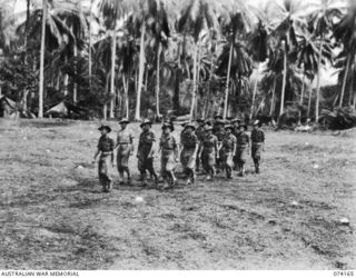 SIAR, NEW GUINEA. 1944-06-22. PERSONNEL OF NO. 11 PLATOON, B COMPANY, 57/60TH INFANTRY BATTALION MARCHING OFF THE UNIT PARADE GROUND. IDENTIFIED PERSONNEL ARE:- VX81108 LIEUTENANT P.B. NINK (1); ..