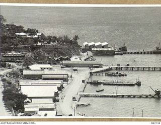 PORT MORESBY, NEW GUINEA. 1943-12-29. DOCK AREAS NEAR THE TOWN, SHOWING PIERS AND SHIPPING, WITH STANLEY ESPLANADE IN THE CENTRE FOREGROUND