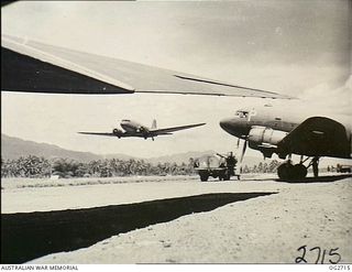 NEW GUINEA. C. 1944. A FEW OF THE HUGE FLEET OF DOUGLAS TRANSPORT AIRCRAFT WHICH MOVE THOUSANDS OF PERSONNEL AND MILLIONS OF POUNDS OF FREIGHT AND MAIL IN AND OUT OF THE AREA EVERY MONTH