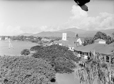 [View of trees, buildings, and mountains]