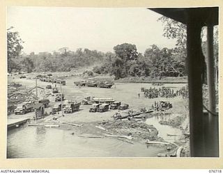 MILFORD HAVEN, LAE, NEW GUINEA. 1944-11-01. A GENERAL VIEW OF THE MARSHALLING POINT AT MILFORD HAVEN FOR THE TROOPS OF HEADQUARTERS, 3RD DIVISION AWAITING TRANSPORT OUT TO THE LIBERTY SHIP LINDLEY ..