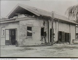 Fanning Island. 7 September 1914. Part of the exterior of the building that housed the Engine Room (middle), Refrigerator and accumulation room of the Pacific Cable Board on Fanning Island after it ..