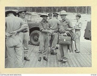 FINSCHHAFEN AREA, NEW GUINEA. 1944-04-25. NGX301 MAJOR N. PENGLASE (1), GREETING MR J. DONOVAN, PRIVATE SECRETARY TO THE MINISTER FOR EXTERNAL TERRITORIES (2), ON HIS ARRIVAL WITH THE HONOURABLE ..