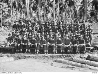 Group portrait of officers and other ranks of A Company, 58/59th Infantry Battalion. 
Left to right: front row: VX120240 Staff Sergeant A. R. Burlison; VX102836 Sergeant J. L. Lyle; VX89390 ..