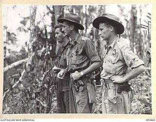 WEWAK AREA, NEW GUINEA. 1945-06-27. LIEUTENANT COLONEL W.S. HOWDEN, COMMANDING OFFICER, 2/8 INFANTRY BATTALION (2), WITH CAPTAIN M.J. DWYER, OFFICER COMMANDING C COMPANY (1) AND SERGEANT F.H. ..