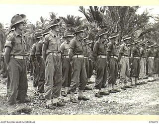 FINSCHHAFEN, NEW GUINEA, 1944-02-29. TROOPS OF THE 2/17TH INFANTRY BATTALION ATTENDING THE OFFICIAL OPENING OF THE FINSCHHAFEN WAR CEMETERY BY VX20308 MAJOR GENERAL F.H. BERRYMAN, CBE, DSO, OFFICER ..