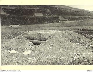 WANDOKAI, NEW GUINEA. 1944-04-17. THE EFFECT OF A NUMBER OF 4.2 INCH MORTAR BOMBS FIRED AT THE JAPANESE LOG BUNKER IN THE FOREGROUND DURING TESTS CONDUCTED BY THE OPERATIONAL RESEARCH SECTION ..