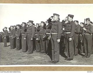 MOUNT MARTHA, VIC. 1943-05-18. IN HONOUR OF THEIR COMRADES WHO DISTINGUISHED THEMSELVES ON GUADALCANAL, THESE MARINES OF THE SEVENTH U.S. MARINE REGIMENT STAND TO AND SALUTE AT A CEREMONIAL PARADE ..