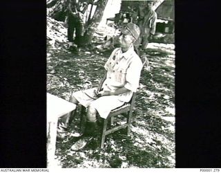 THE SOLOMON ISLANDS, 1945-10-13. JAPANESE OFFICER UNDERGOING INTERROGATION AT KANDAS ISLAND INTERNMENT CAMP. (RNZAF OFFICIAL PHOTOGRAPH.)