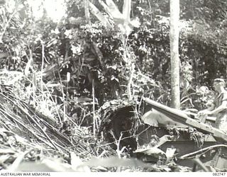 A Churchill IV tank sliding on a rock face at the end of Course no. 1 during tests conducted at HQ 4 Armoured Brigade