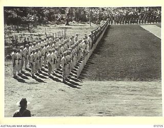 LAE, NEW GUINEA. 1944-04-25. UNITED STATES ARMY PERSONNEL (AT THE FOREGROUND), AND AUSTRALIAN TROOPS LINED IN FORMATION DURING THE OFFICIAL DEDICATION AT THE LAE WAR CEMETERY CONDUCTED BY NX8 ..