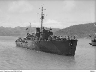 The Bathurst class Corvette, HMAS Armidale, in Port Moresby harbour, after successfully convoying troopships and supply vessels from Australia