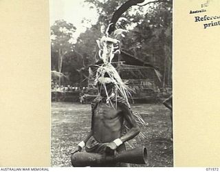 SONG RIVER, FINSCHHAFEN AREA, NEW GUINEA. 1944-03-26. ONE OF THE HEAD-DRESSES WORN DURING THE SING-SING HELD BY NATIVES IN THE AUSTRALIAN NEW GUINEA ADMINISTRATIVE UNIT COMPOUND TO CELEBRATE RE ..