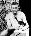 Herb Mack holding cat, Fiji, 1943