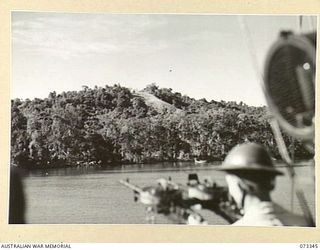 ULIGAN HARBOUR, NEW GUINEA. 1944-05-21. THE HARBOUR DURING A RECONNAISSANCE AND STRAFING MISSION BY HMA MOTOR LAUNCHES. THE BOMBARDMENT LEFT DAMAGED STORES AND 5 FIRES BURNING AT THE CONCLUSION OF ..