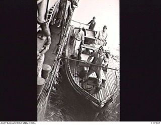 NAURU ISLAND. 1945-09-13. THE LAUNCH OF THE JAPANESE SURRENDER ENVOY BEING MADE FAST TO THE ROYAL AUSTRALIAN NAVY VESSEL HMAS DIAMANTINA