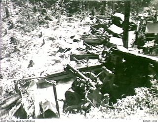 THE SOLOMON ISLANDS, 1945-01-12. ONE GUN, OF AN AIF 25 POUND BATTERY, IN ACTION. (RNZAF OFFICIAL PHOTOGRAPH.)