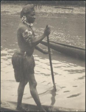 Woman standing in canoe, possibly Bosman village, Ramu River, New Guinea, 1935 / Sarah Chinnery