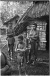 Babaimp: Kalam adolescent boy and children next to house