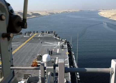 U.S. Navy Sailors aboard the Tarawa Class Amphibious Assault Ship USS SAIPAN (LHA 2) enjoy the view as their ship sails through the Suez Canal in Egypt on Sept. 2, 2006. SAIPAN is currently underway conducting maritime security operations. (U.S. Navy photo by Mass Communication SPECIALIST SEAMAN Patrick W. Mullen III) (Released)