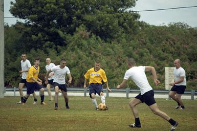 The US Navy (USN) Varsity Soccer team plays against the Russian Federation Navy (RFN) Soccer team, in an exhibition match at Blue Jacket Field, at Santa Rita, Guam (GU). RFN ships are in Guam participating in Exercise PASSEX 06, an exercise designed to increase interoperability between the two navies while enhancing the strong cooperative relationship between Russia and the United States