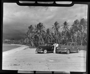 Two taxis parked on Saweni Beach, Fiji