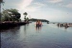 A group of unidentified men in boat approaching Non Matol Ponape, Micronesia