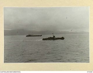 1943-07-12. AMERICAN ADVANCE INTO TROBRIAND ISLANDS. THIS PICTURE IS ONE OF THE FIRST OF THE AMERICAN ADVANCE AND SHOWS TWO SHIPS OF THE CONVOY SAILING NORTHWARD UNDER SULLEN SKIES. (NEGATIVE BY N. ..
