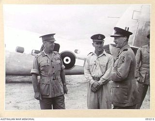 JACQUINOT BAY, NEW BRITAIN, 1945-06-16. THE GOVERNOR GENERAL OF NEW ZEALAND, MARSHAL OF THE ROYAL AIR FORCE, SIR CYRIL L.N. NEWALL (3). CHATTING AT THE AIRSTRIP TO MAJ-GEN H.C.H. ROBERTSON, GOC 5 ..