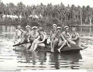 MADANG, NEW GUINEA. 1944-08-25. MEMBERS OF THE AUSTRALIAN ARMY NURSING SERVICE RELAXING ON THE WATER IN A RUBBER RAFT WITH RAN OFFICERS FROM THE HMAS "KANIMBLA". IDENTIFIED PERSONNEL ARE:- WFX1569 ..