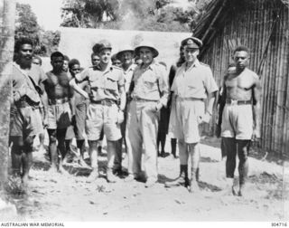LUNGA, GUADALCANAL, BRITISH SOLOMON ISLANDS PROTECTORATE. 1945-03-27. LIEUTENANT COMMANDER W. J. (JACK) READ, NAVAL INTELLIGENCE DIVISION, RAN, (RESPONSIBLE FOR THE COASTWATCHERS). WITH HIS NATIVE ..