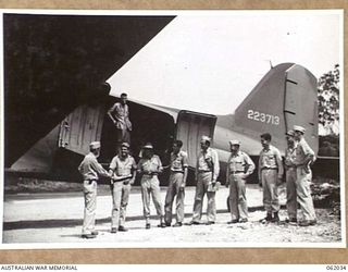 DREGER HARBOUR, NEW GUINEA. 1943-12-07. A DOUGLAS TRANSPORT AIRCRAFT IS THE FIRST LARGE AIRCRAFT TO LAND ON THE NEW STRIP BUILT BY ENGINEERS OF THE 870TH UNITED STATES AVIATION ENGINEER BATTALION. ..